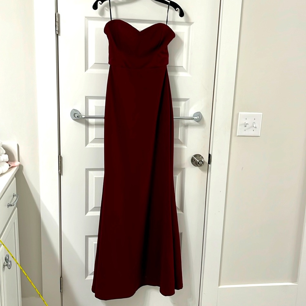 Gorgeous full length strapless burgundy gown. Sweetheart neckline